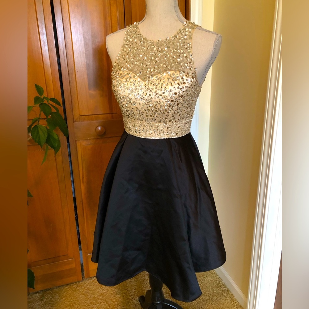 Beautiful gold black jeweled party dress never worn.